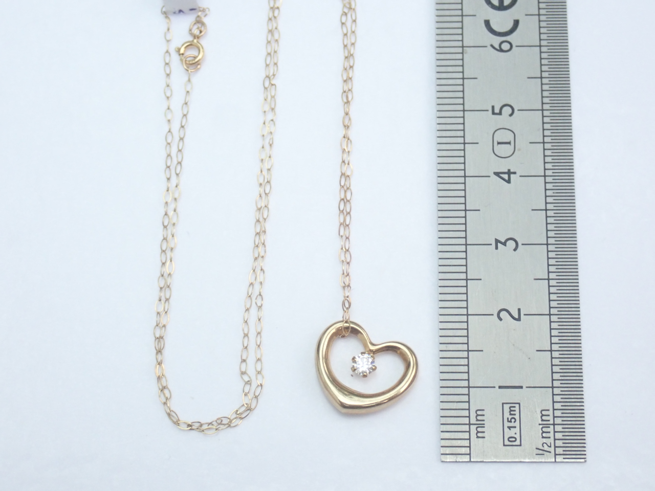 Floating Heart Cubic Zirconia Pendant 375 9k - 16 inch 9k gold Chain